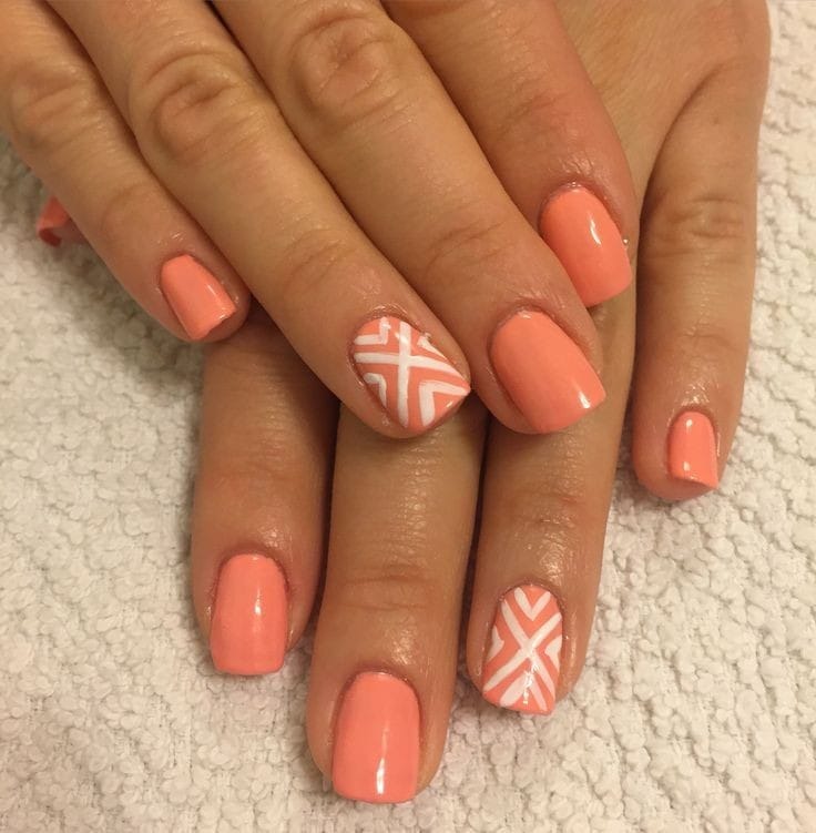 Coral Nails with White Geometric Patterns