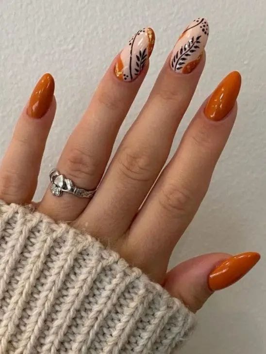 burnt orange with leafy accents fall nails