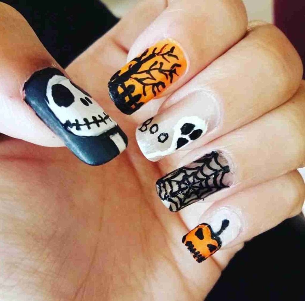 Boo-tiful Night pumpkin Halloween nail designs