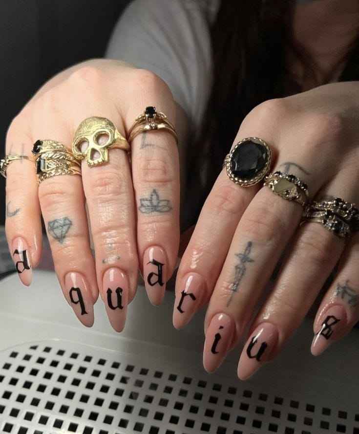 Symbolic Black Letters nail ideas