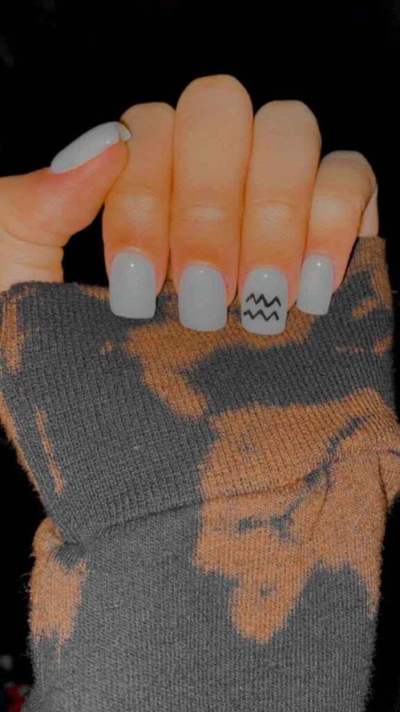 White Shorties with Bold Aquarius Symbol nail art